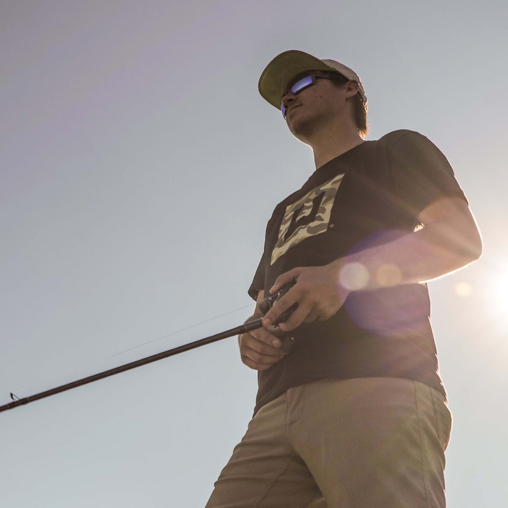 man fishing in a fish graphic tee